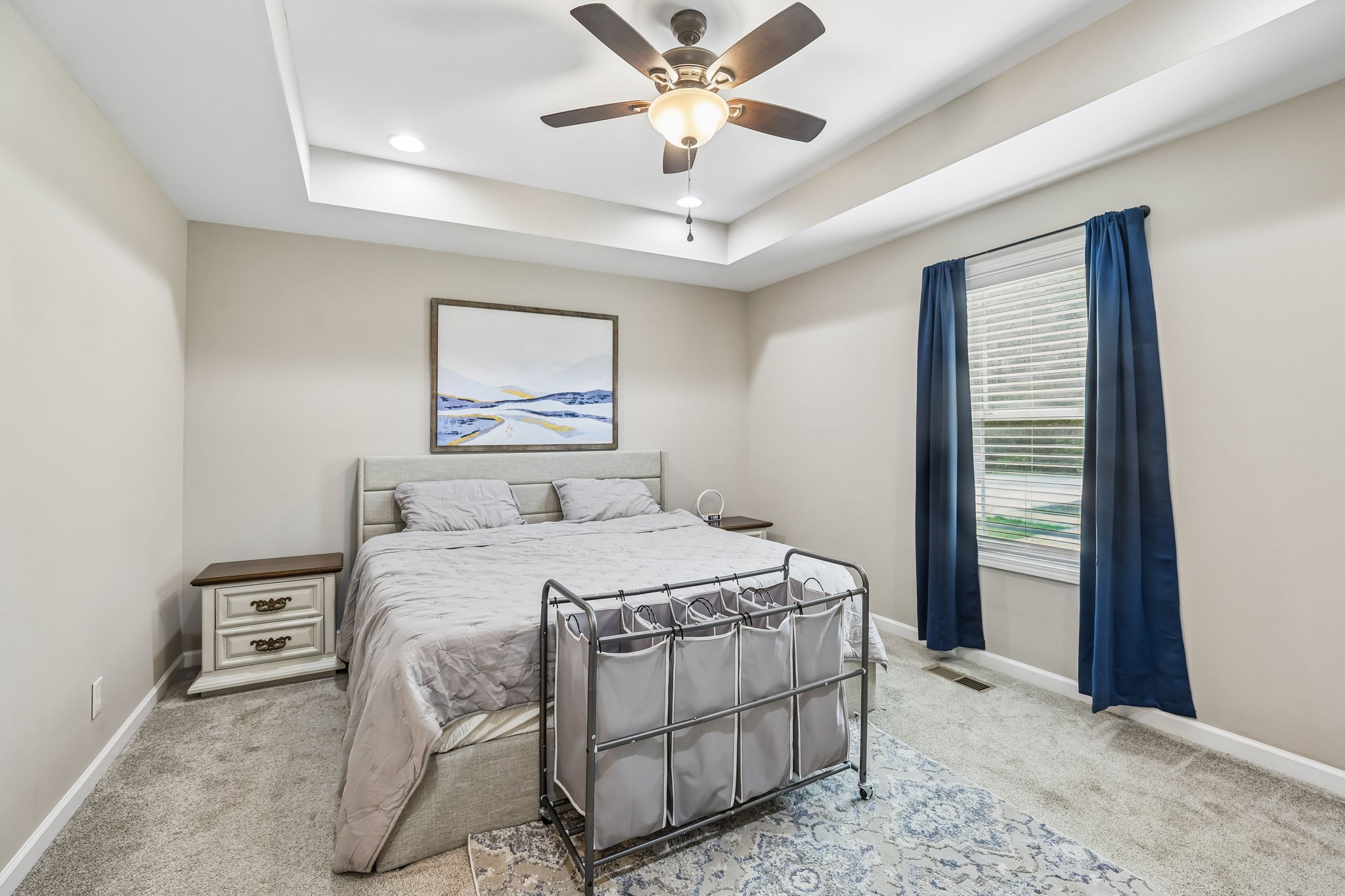 1546 South Spring Street Manchester, TN 37355 - Photo 27 of 53 a bedroom with a bed and a chandelier