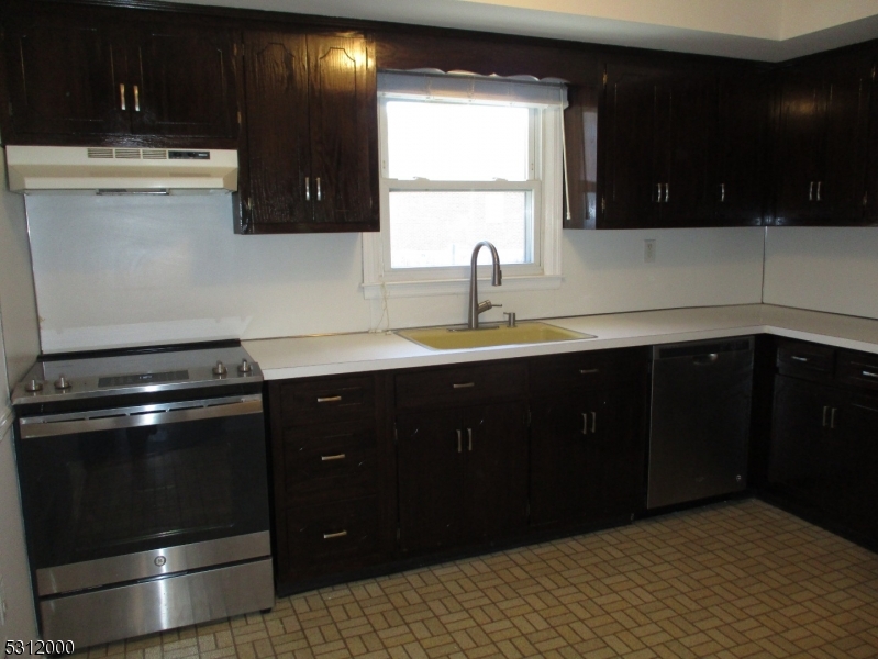 777 Springfield Avenue, Unit 17 Summit, NJ 07901 - Photo 11 of 25 a kitchen with a sink and a stove
