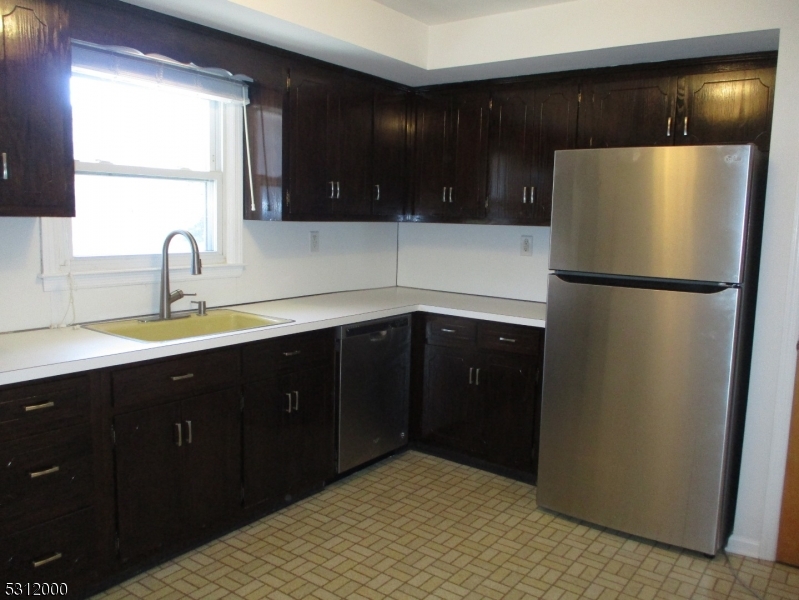 777 Springfield Avenue, Unit 17 Summit, NJ 07901 - Photo 12 of 25 a kitchen with a refrigerator and a sink