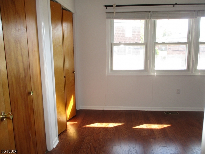 777 Springfield Avenue, Unit 17 Summit, NJ 07901 - Photo 16 of 25 a view of a small space with wooden floor and a window