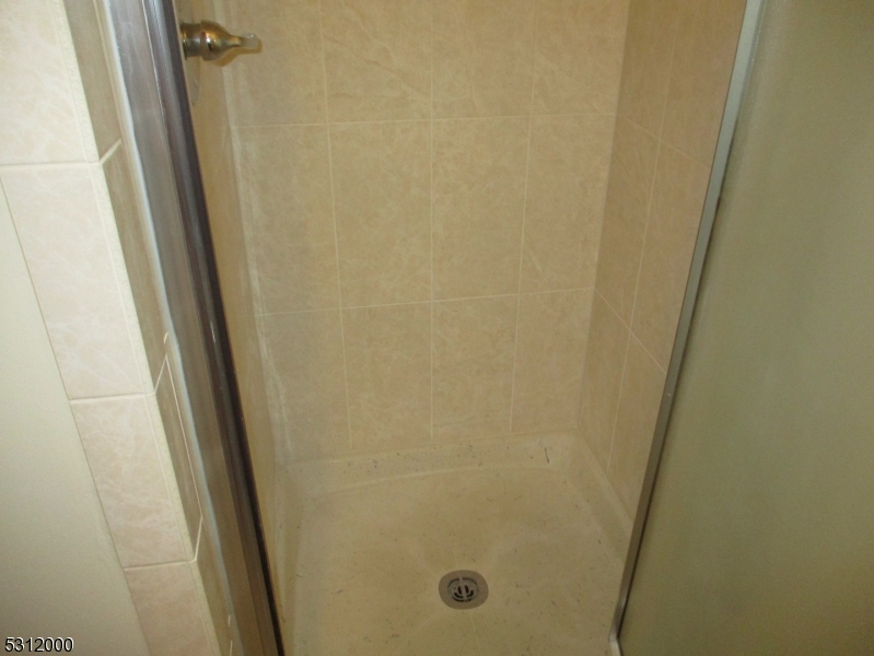 777 Springfield Avenue, Unit 17 Summit, NJ 07901 - Photo 19 of 25 a bathroom with a shower and a sink