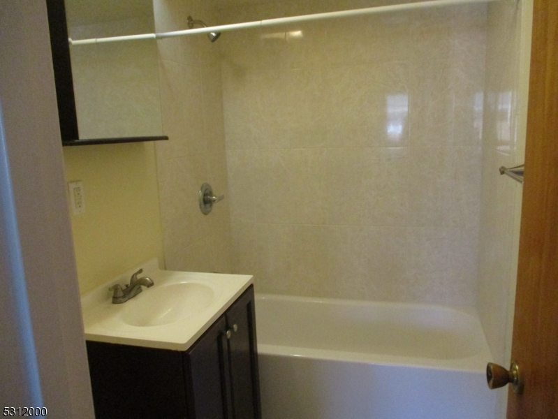 777 Springfield Avenue, Unit 17 Summit, NJ 07901 - Photo 24 of 25 a bathroom with a sink and a bathtub