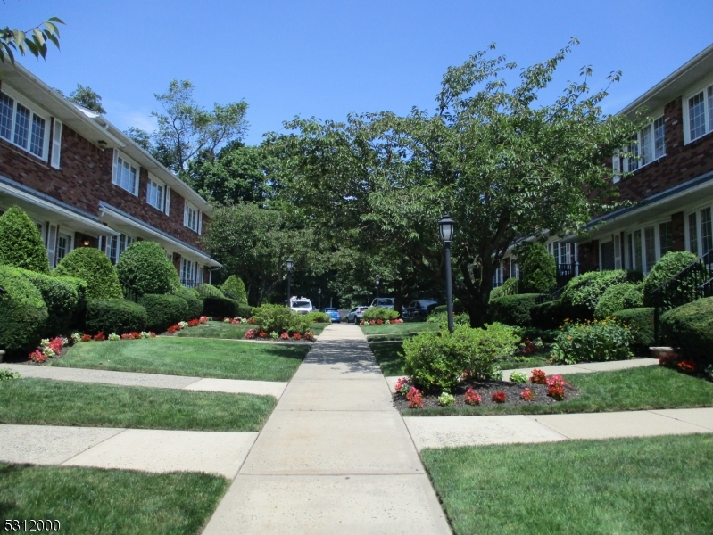 777 Springfield Avenue, Unit 17 Summit, NJ 07901 - Photo 3 of 25 a front view of a house with a yard