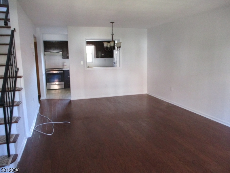 777 Springfield Avenue, Unit 17 Summit, NJ 07901 - Photo 5 of 25 a view of an empty room with kitchen and a window