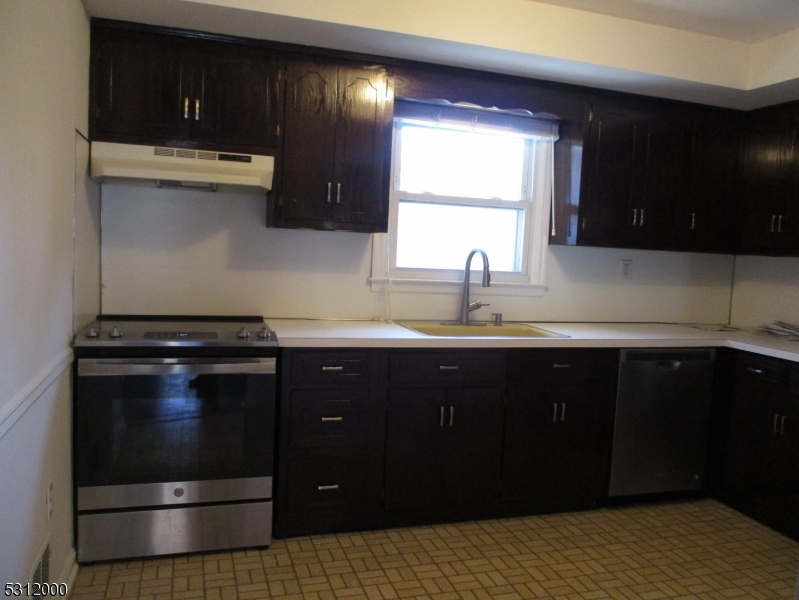 777 Springfield Avenue, Unit 17 Summit, NJ 07901 - Photo 10 of 25 a kitchen with a sink and a stove