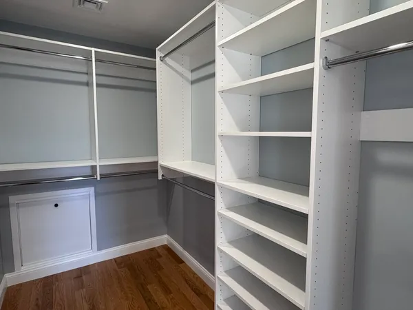 a view of an empty walk in closet