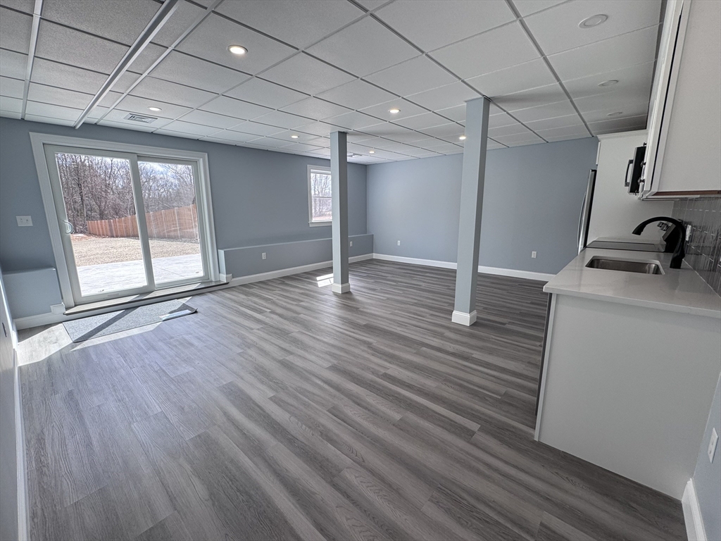 193 East Spring Street Avon, MA 02322 - Photo 20 of 27 a view of a livingroom with wooden floor
