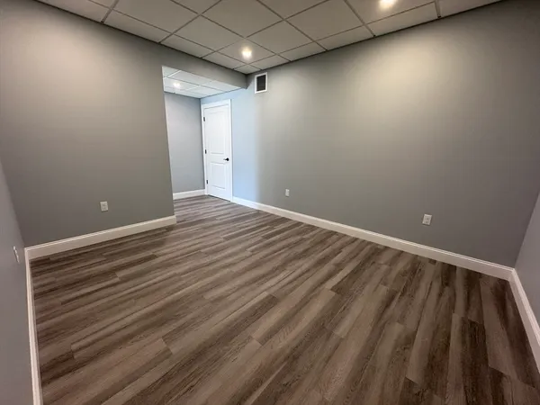 a view of room with wooden floor