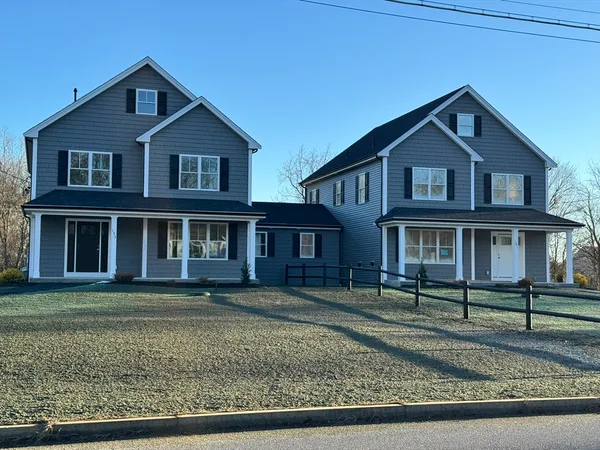 a front view of a house with a yard