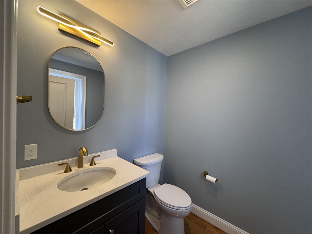 193 East Spring Street Avon, MA 02322 - Photo 9 of 27 a bathroom with a sink and a mirror