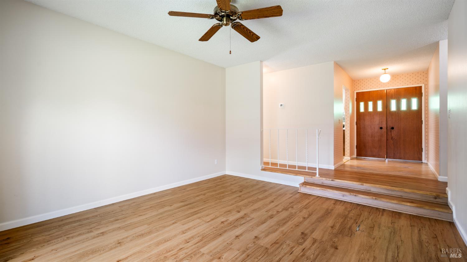 1536 Sunview Court Santa Rosa, CA 95401 - Photo 11 of 28 a view of an empty room and wooden floor