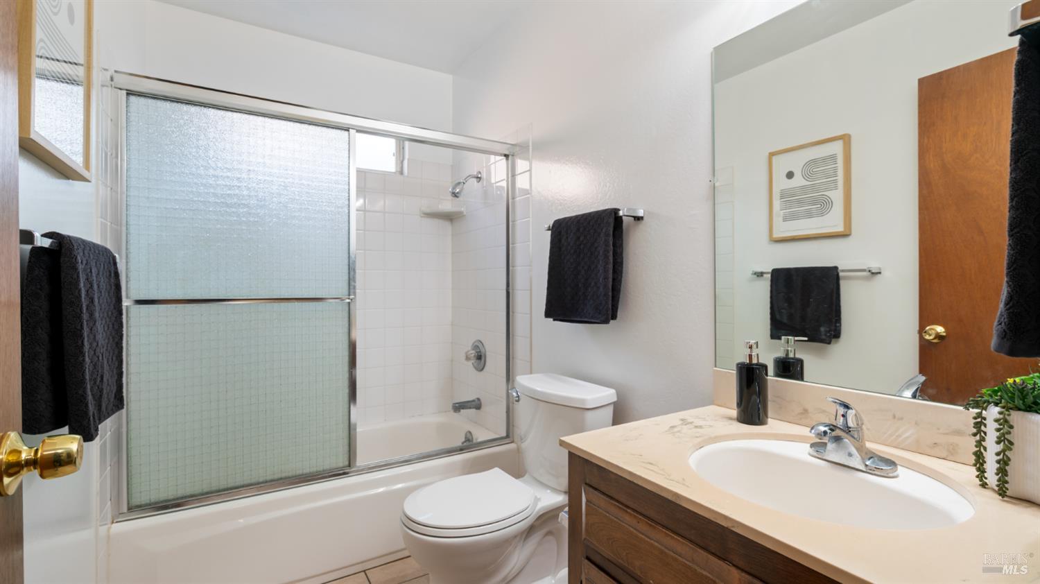 1536 Sunview Court Santa Rosa, CA 95401 - Photo 14 of 28 a bathroom with a sink toilet and shower