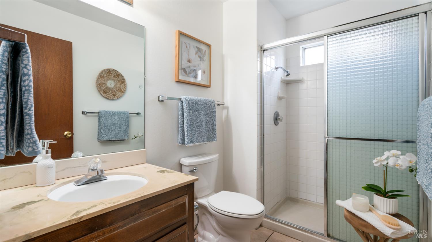 1536 Sunview Court Santa Rosa, CA 95401 - Photo 19 of 28 a bathroom with a granite countertop sink toilet a mirror and shower