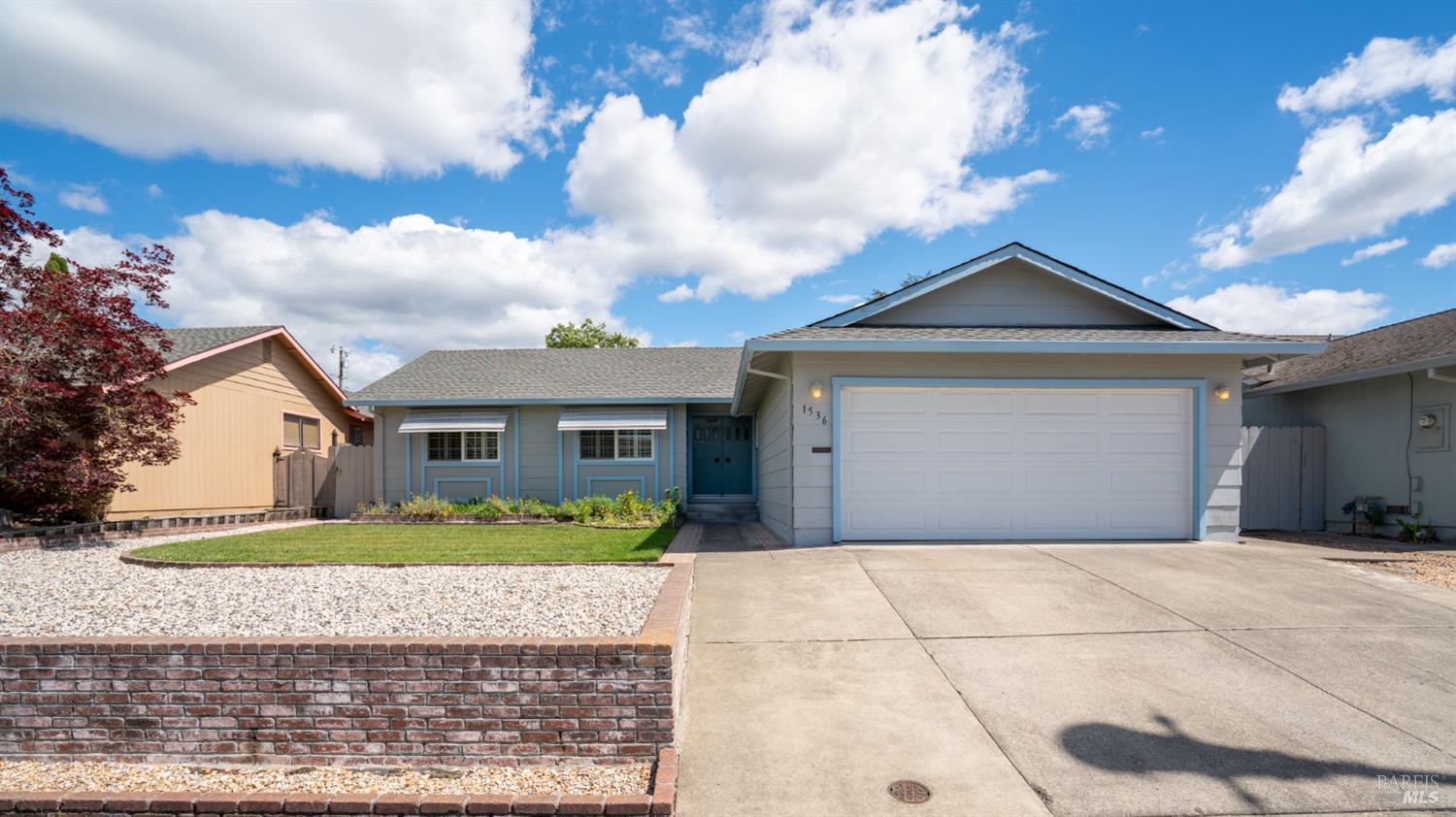 1536 Sunview Court Santa Rosa, CA 95401 - Photo 26 of 28 a front view of a house with a yard and garage