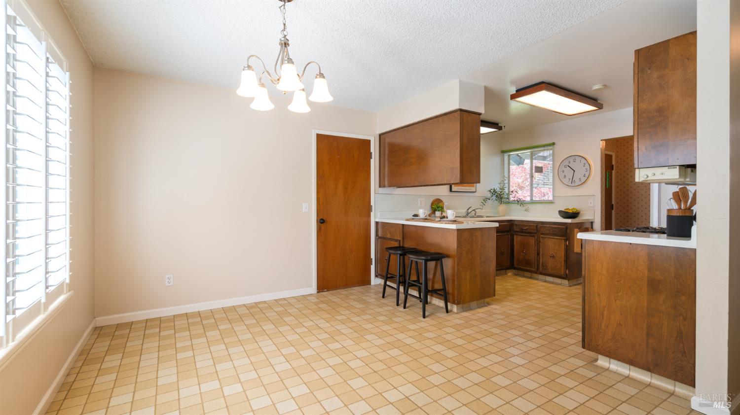 1536 Sunview Court Santa Rosa, CA 95401 - Photo 6 of 28 a room with a chandelier furniture and a chandelier