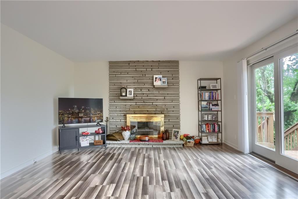 5607 McCormick Road Pittsburgh, PA 15205 - Photo 13 of 33 a living room with furniture and a fireplace