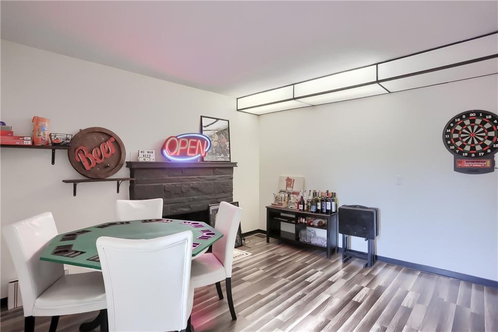5607 McCormick Road Pittsburgh, PA 15205 - Photo 19 of 33 a living room with furniture and paintings on the wall