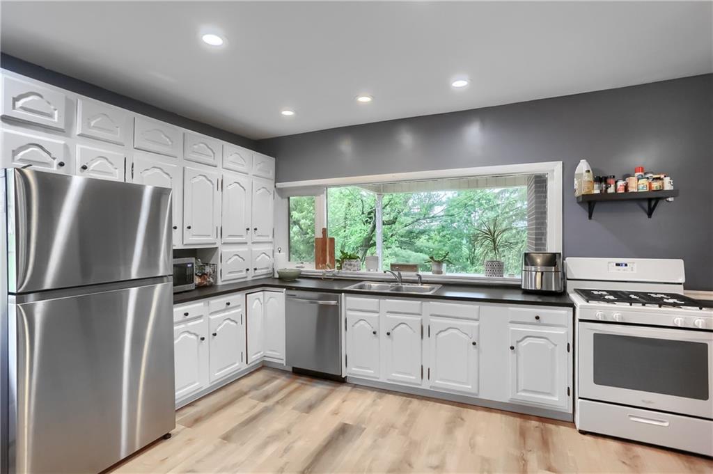 5607 McCormick Road Pittsburgh, PA 15205 - Photo 4 of 33 a kitchen with granite countertop a sink stainless steel appliances and cabinets
