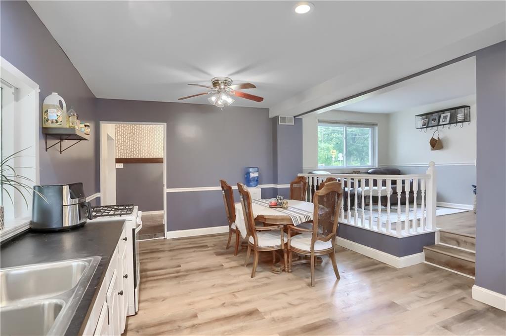 5607 McCormick Road Pittsburgh, PA 15205 - Photo 6 of 33 a view of a dining room with furniture window and wooden floor