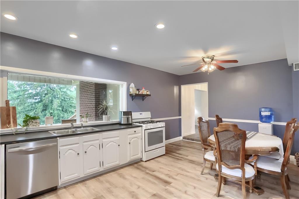 5607 McCormick Road Pittsburgh, PA 15205 - Photo 7 of 33 a kitchen with a table chairs and microwave