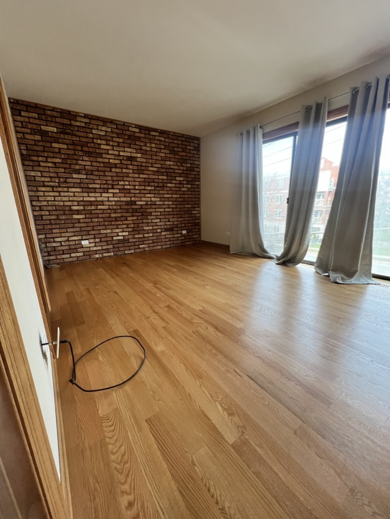 1988 Green Bay Road, Unit 1 Highland Park, IL 60035 - Photo 8 of 13 wooden floor in a hall with an entryway