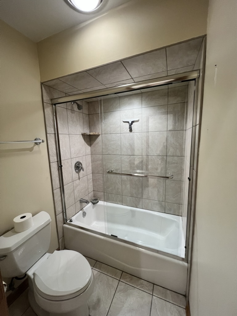 1988 Green Bay Road, Unit 1 Highland Park, IL 60035 - Photo 10 of 13 a bathroom with a shower and a toilet