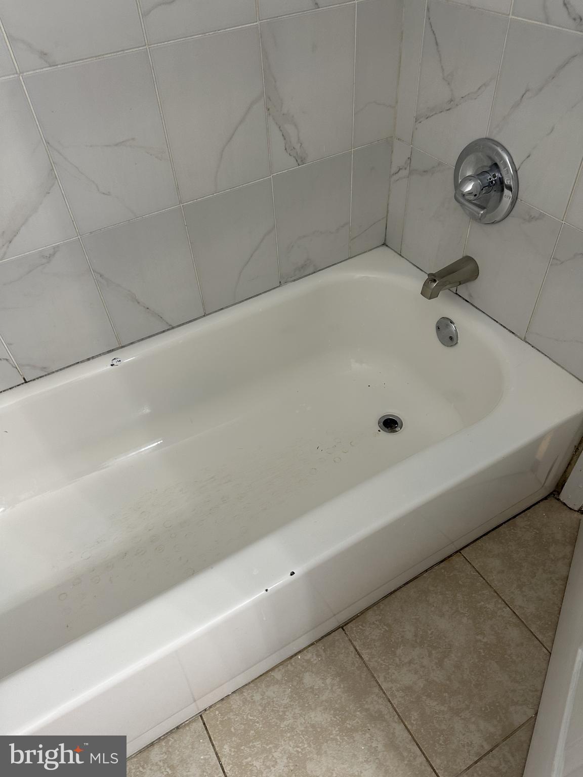 19525 Gunners Branch Road, Unit G Germantown, MD 20876 - Photo 17 of 21 a bathroom with a bathtub