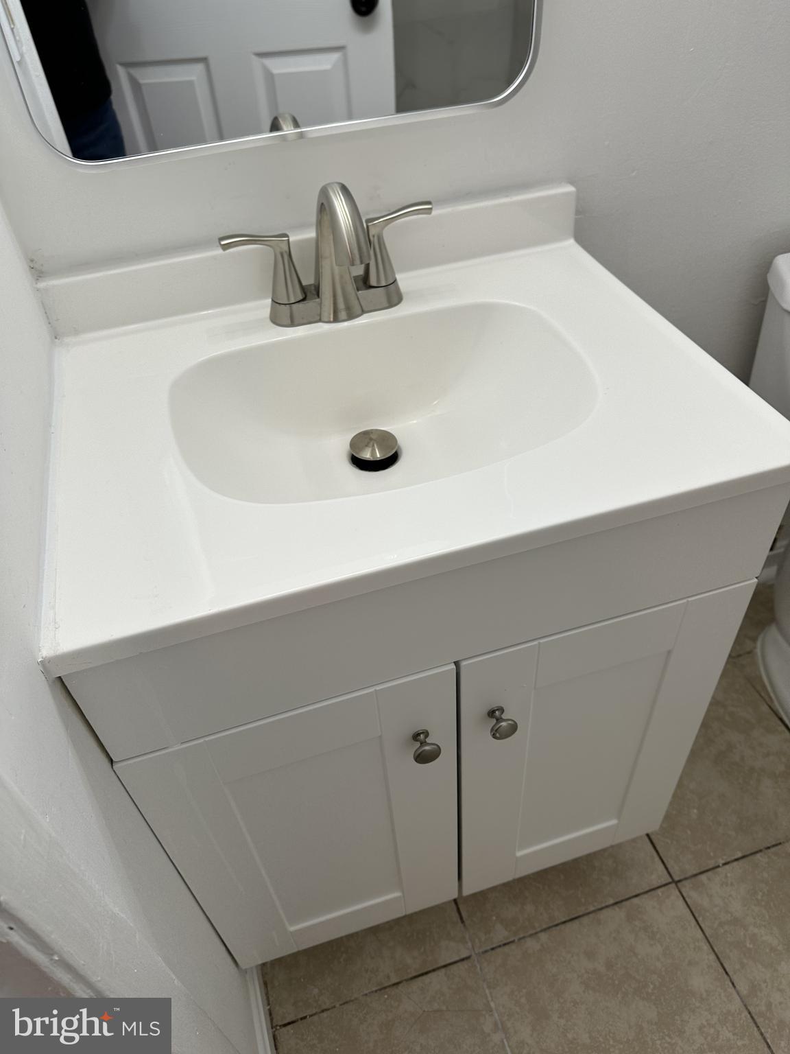 19525 Gunners Branch Road, Unit G Germantown, MD 20876 - Photo 19 of 21 a close view of sink and tap