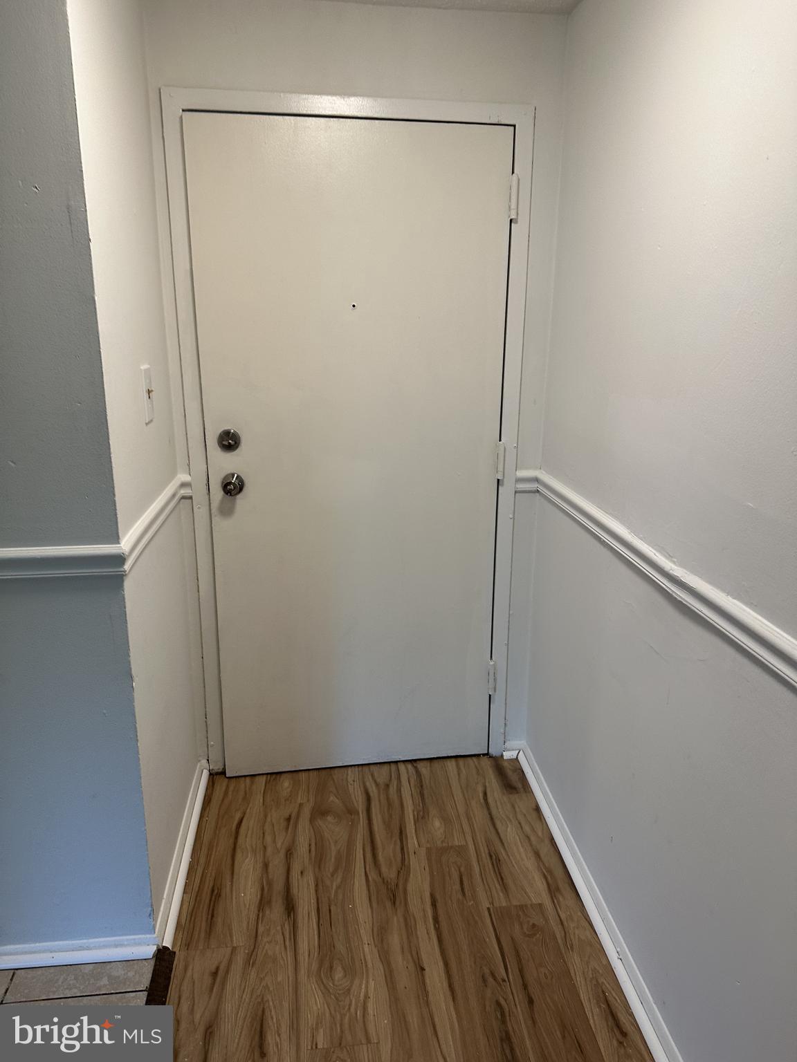 19525 Gunners Branch Road, Unit G Germantown, MD 20876 - Photo 3 of 21 a view of a room with wooden floor and cabinet