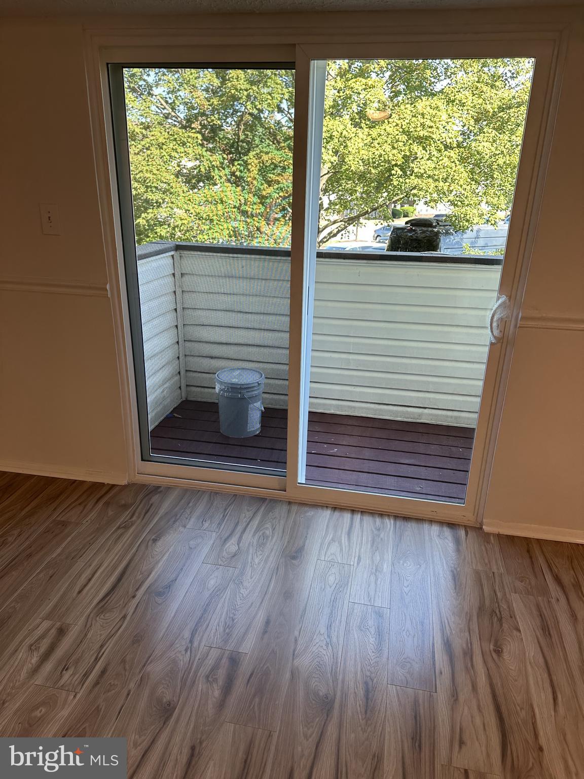 19525 Gunners Branch Road, Unit G Germantown, MD 20876 - Photo 6 of 21 a view of empty room with wooden floor and fan