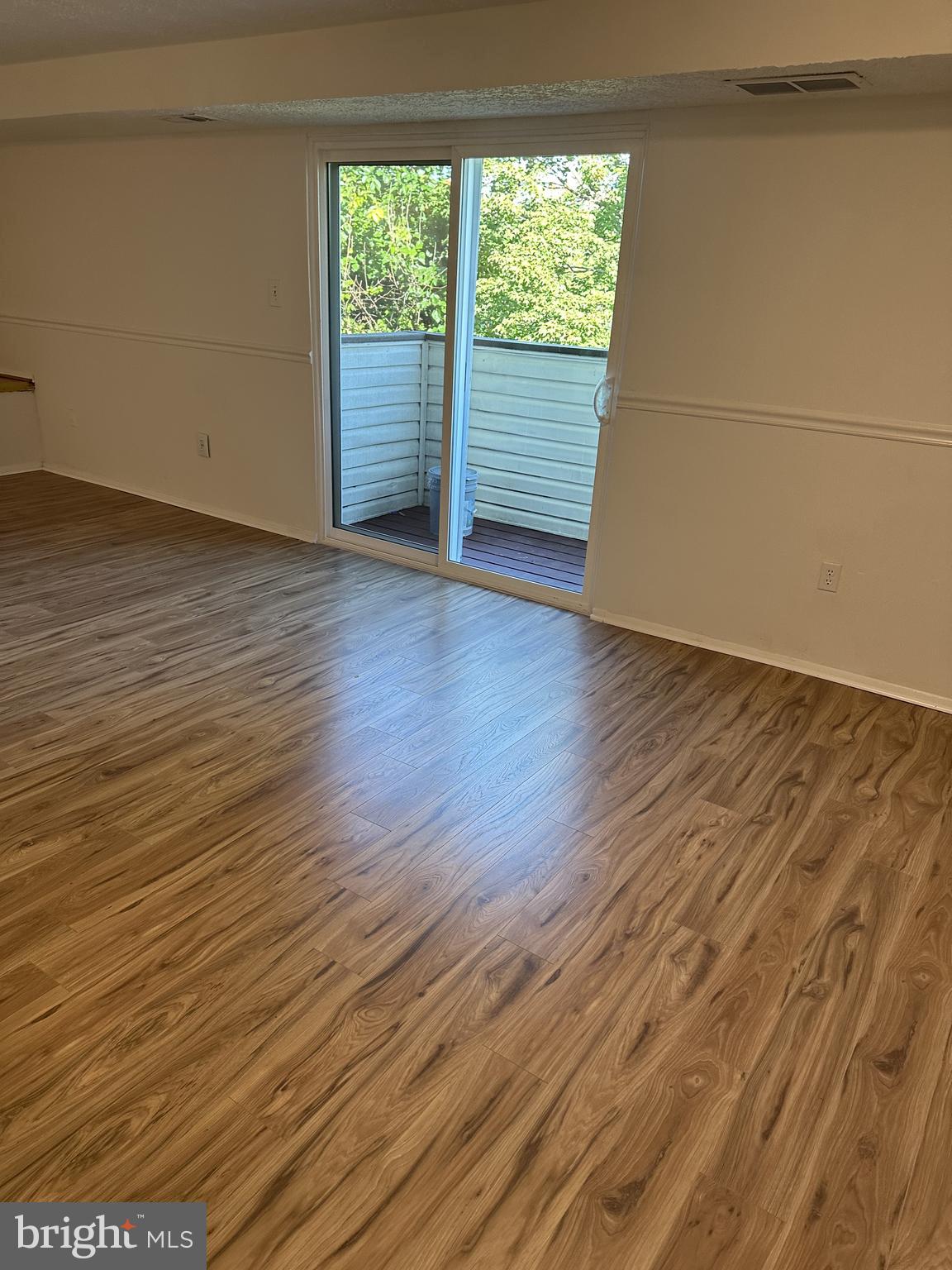 19525 Gunners Branch Road, Unit G Germantown, MD 20876 - Photo 10 of 21 a view of a livingroom with wooden floor