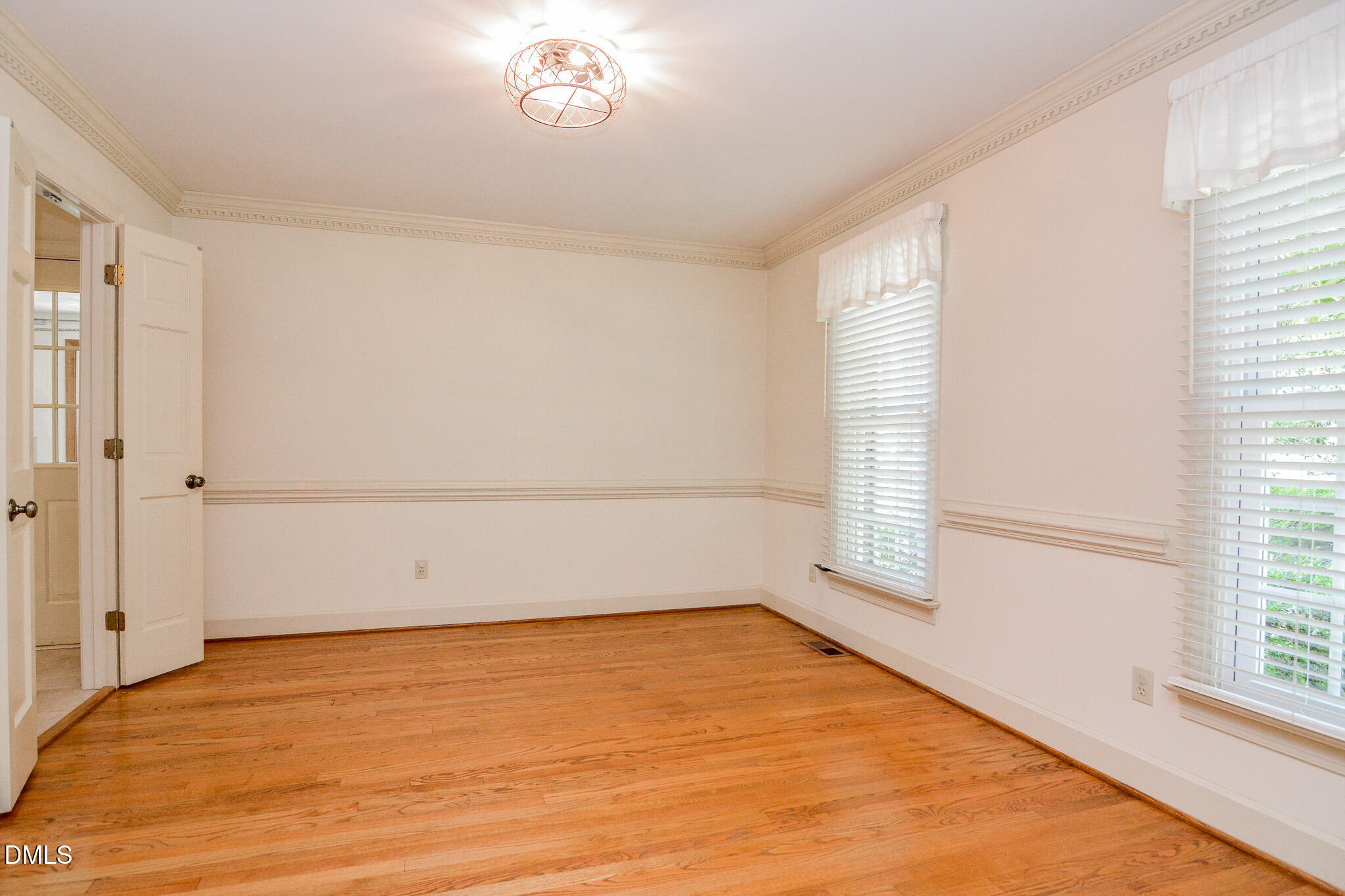 1215 Cambridge Road Northwest Wilson, NC 27896 - Photo 30 of 54 wooden floor in an empty room with a window