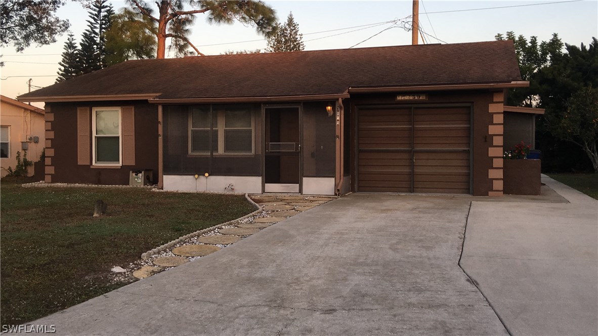 7259 Buchanan Road Fort Myers, FL 33967 - Photo 3 of 13 front view of a house with a yard