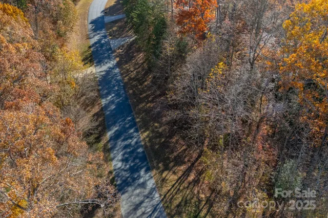 an aerial view of house with beach and ocean view
