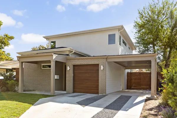 a front view of a house with yard