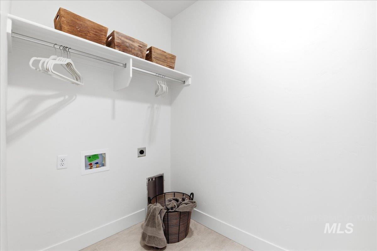 3405 Elliptical Lane Caldwell, ID 83607 - Photo 11 of 17 Dedicated laundry area featuring white walls, baseboards, and light-toned flooring