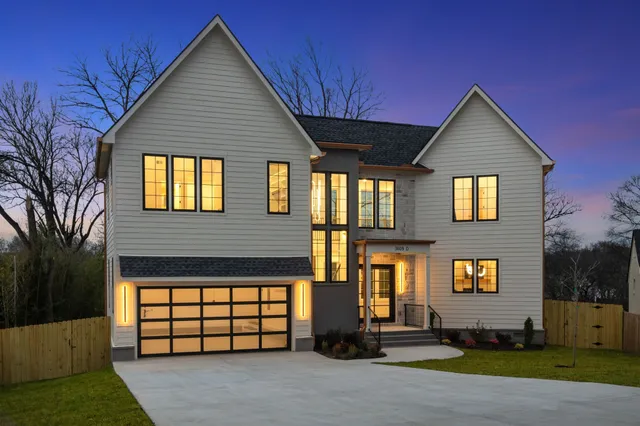 a kitchen with a sink appliances and cabinets