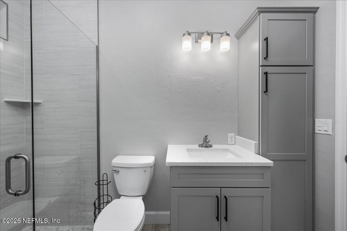 108 Pamela Street Interlachen, FL 32148 - Photo 27 of 31 a bathroom with a toilet sink and shower