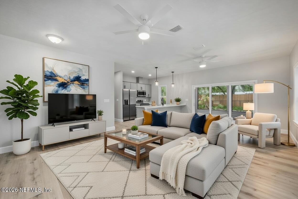 108 Pamela Street Interlachen, FL 32148 - Photo 10 of 31 a living room with furniture and a flat screen tv