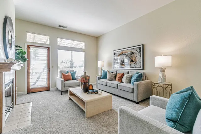 a living room with furniture and a large window