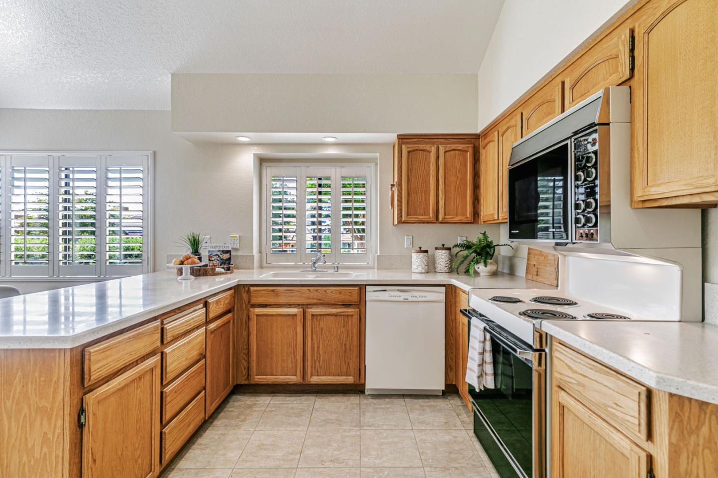 7530 Morevern Circle San Jose, CA 95135 - Photo 21 of 41 a kitchen with stainless steel appliances granite countertop a sink stove and cabinets