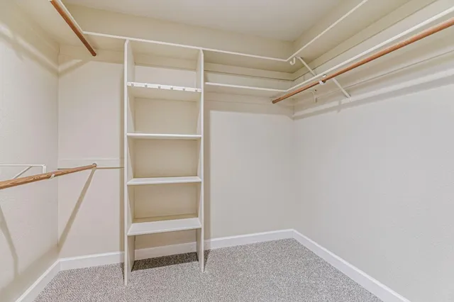 a view of an empty walk in closet