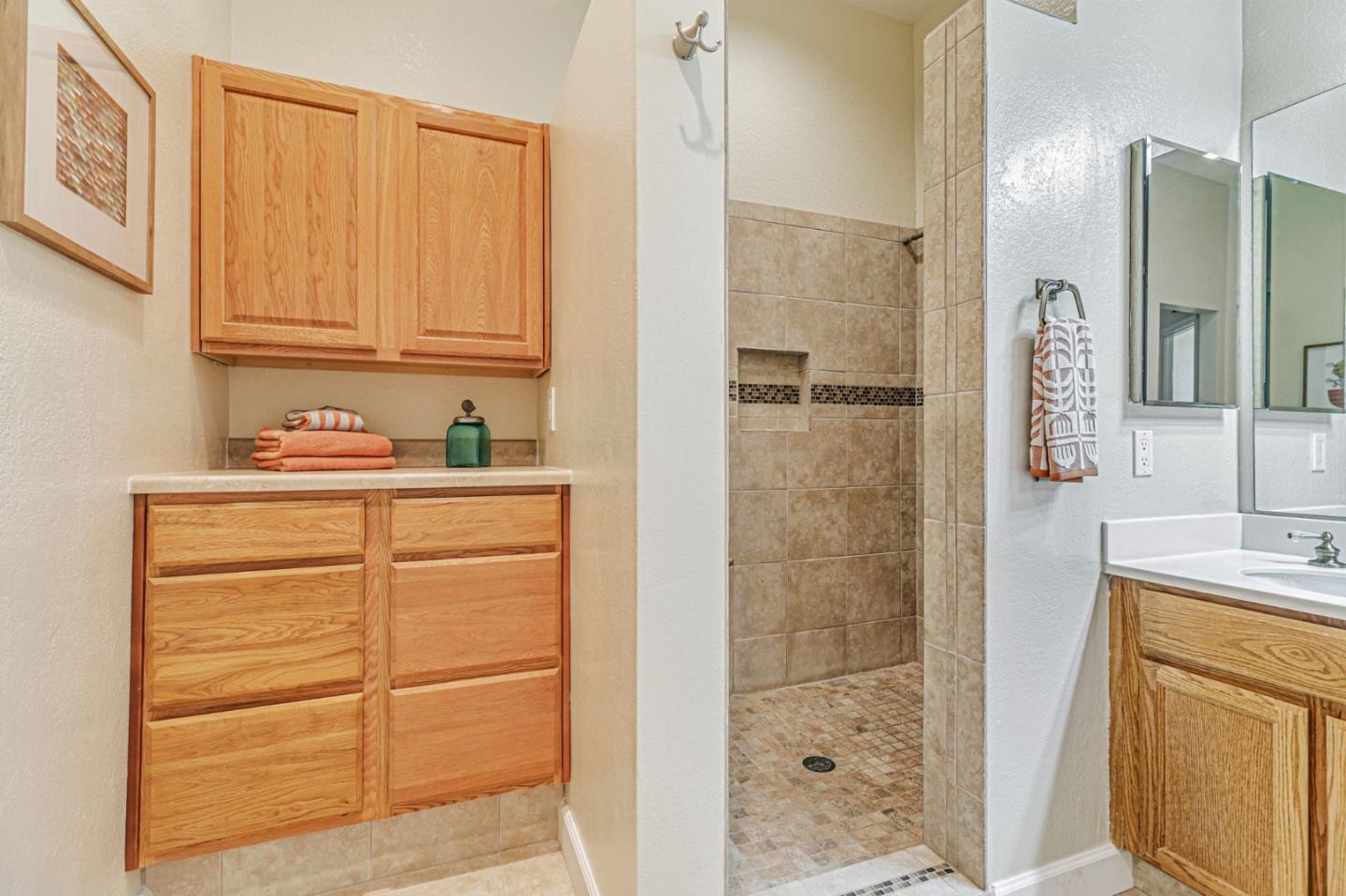 7530 Morevern Circle San Jose, CA 95135 - Photo 30 of 41 a bathroom with a shower sink and mirror