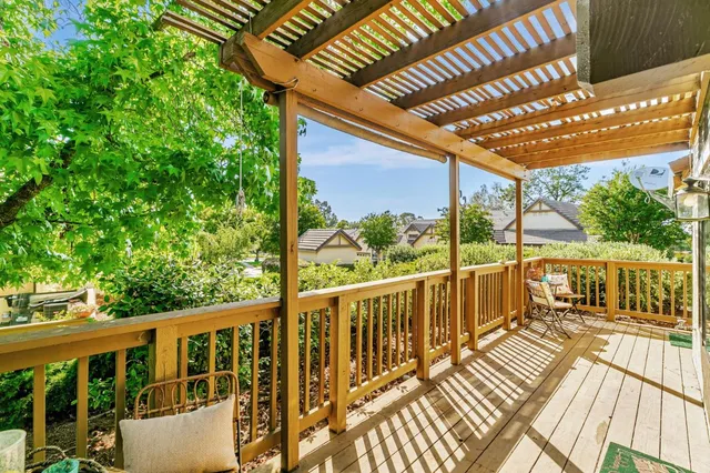 a view of a balcony with wooden floor