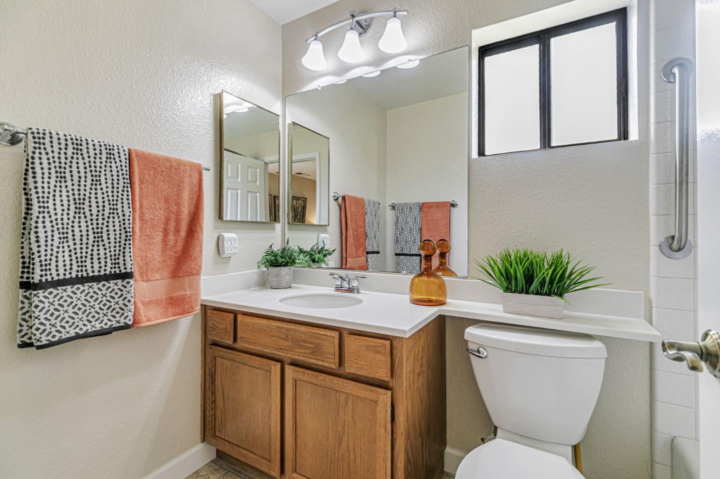 7530 Morevern Circle San Jose, CA 95135 - Photo 9 of 41 a bathroom with a sink a toilet and mirror
