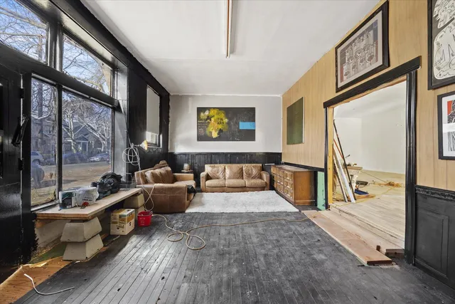 a view of a room with furniture and a window