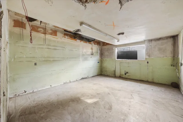 a view of a chairs and table in a room