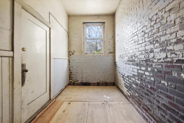 a view of entryway with wooden floor