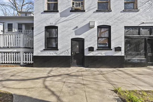 a front view of a house with stairs