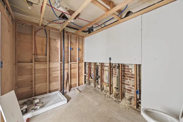 a view of hallway with furniture